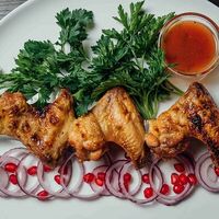 Куриные крылышки на углях в Огонь и Мясо