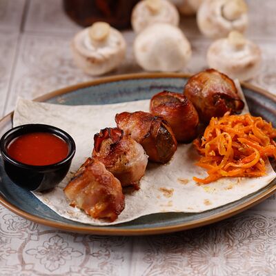 Шампиньоны в беконе в Аджика по цене 740 ₽