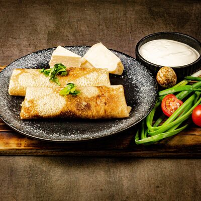 Блинчики с ветчиной и сыром в У Сватов по цене 350 ₽