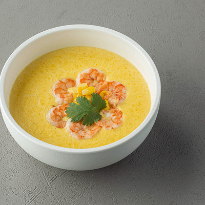 Сладкий кукурузный суп-пюре с креветками в Диккенс по цене 560 ₽