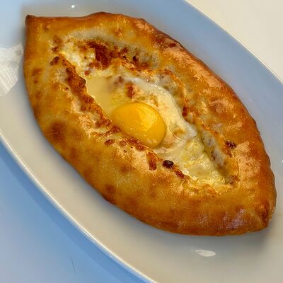 Хачапури по-аджарски в Кафе Майами по цене 450 ₽