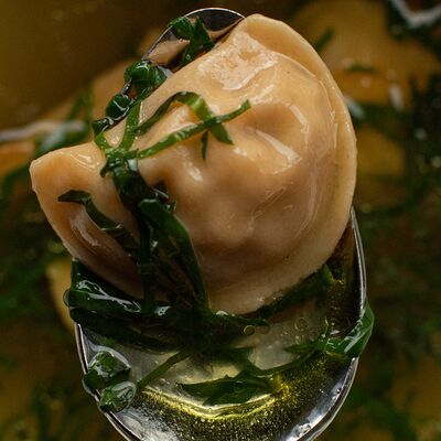 Куриное консоме с эмпанадас, травы в Padron по цене 750 ₽