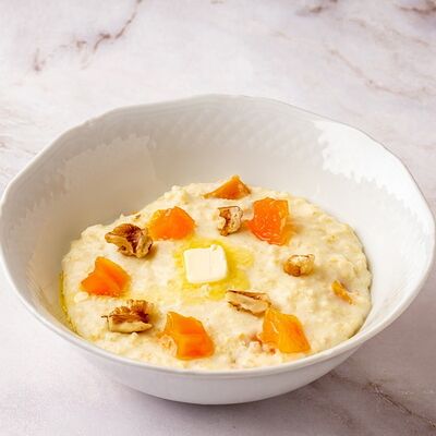 Каша пшенная с тыквой, изюмом и грецким орехом в Кофейня Пенка по цене 380 ₽