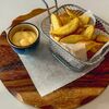 Картофельные дольки с чесноком и сырным соусом в Лето Море Фидель по цене 300