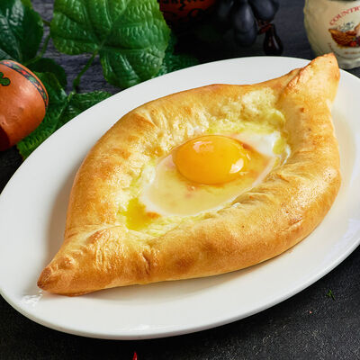 Хачапури по-аджарски (лодочка) в Лагидзе по цене 490 ₽