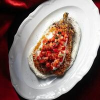 Хрустящий баклажан с томатами и страчателлой в Nino