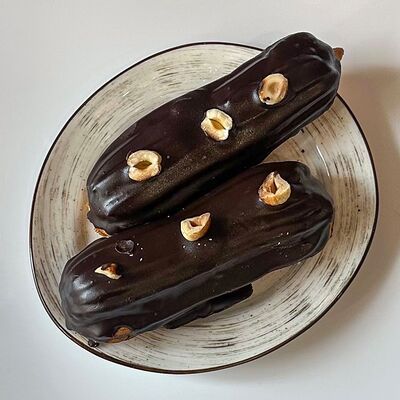 Шоколадный эклер в Farina Ватрушкина по цене 239 ₽