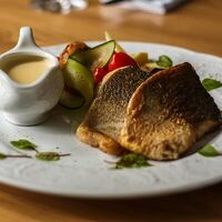 Подкопченный сиг в пергаменте с цукини на гриле в Ресторация купца 1 гильдии Я. А. Немчинова