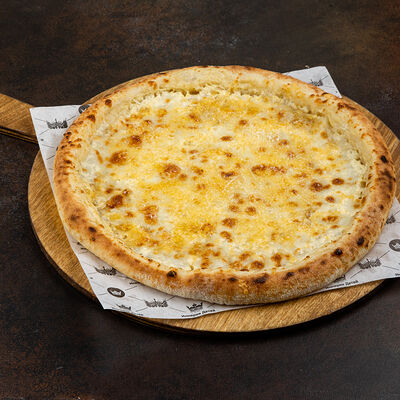 Пицца Четыре сыра в Город детей по цене 656 ₽