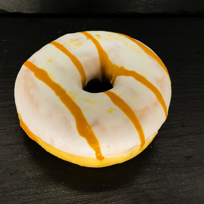 Донат с карамельной начинкой в Пекарня Буханка по цене 85 ₽