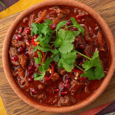 Тушеная баранина с гранатом и ткемали в Птичка по цене 980 ₽