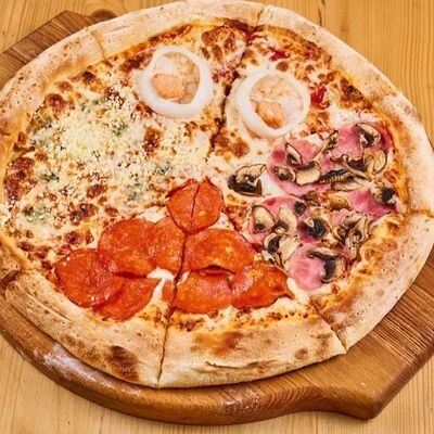 Пицца Четыре сезона в 4 сыра по цене 1140 ₽