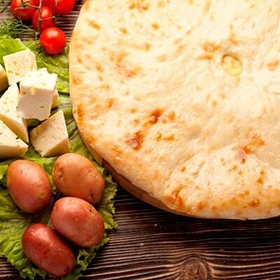 Осетинский пирог с картошкой и осетинским сыром в Осетинские пироги от Забавы по цене 1200 ₽