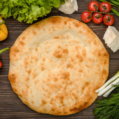 Горячая лепешка в Осетинские пироги Вкусно Пироги по цене 100