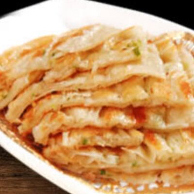 Лепешка с луком-пореем в ГУаНЬ ЯНЬ по цене 780 ₽