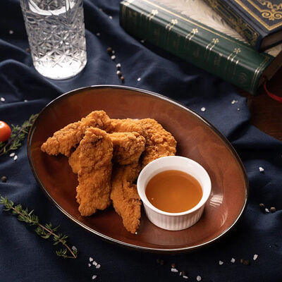 Куриные стрипсы в Ирландский паб Тринити по цене 590 ₽