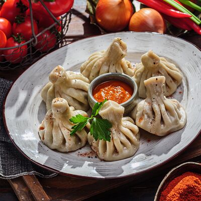 Хинкали с сулугуни и зеленью в Пельмения по цене 672 ₽