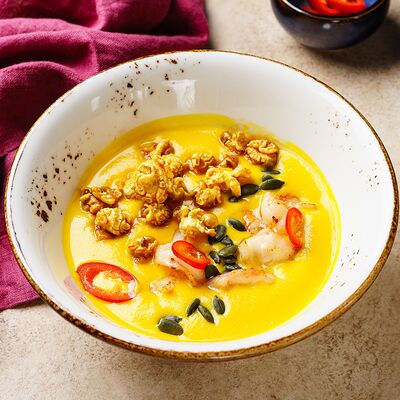 Тыквенный крем-суп с креветками в Nonna bonna по цене 450 ₽