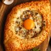 Хачапури по-аджарски с картофелем и грибами в Нино по цене 820