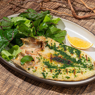 Целый сибас, масло, чеснок, петрушка в Айна по цене 2150 ₽