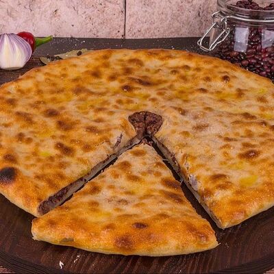 Пирог с мясом халяль в National по цене 1400 ₽