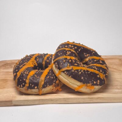 Пончик Донатс с начинкой Апельсин и глазурью из темного шоколада в Do.bro coffee по цене 270 ₽