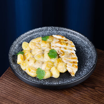 Картофельные ньоки в сливочно-мясном соусе с куриным филе в Pafos по цене 520 ₽