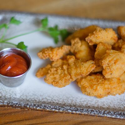 Куриные стрипсы с томатным соусом в Дюшес по цене 550