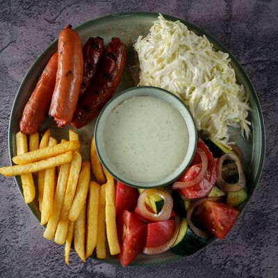 На тарелке с баварскими сосисками в Гаучо по цене 790 ₽