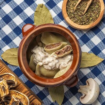 Вареники с ливером и грибным соусом в Вареничная №1 по цене 718 ₽