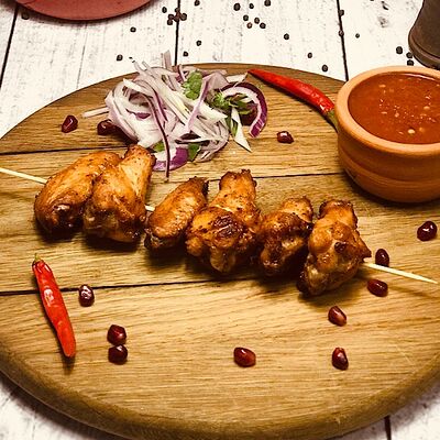 Шашлык из куриных крылышек в Buta по цене 470 ₽
