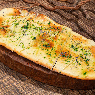 Лепешка, ароматные травы, чеснок в Айна по цене 550 ₽