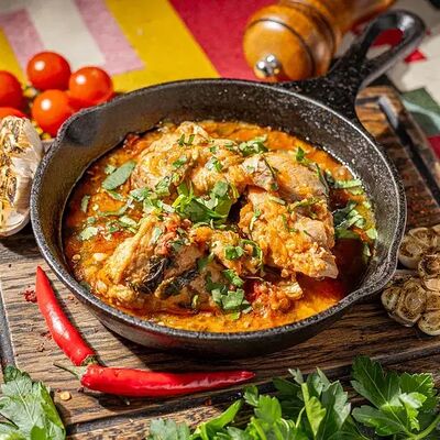 Куриное чахохбили со сладкими томатами в Хачапури по цене 590 ₽