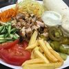 Шаурма из курицы на тарелке в Халяль Galata Food по цене 615