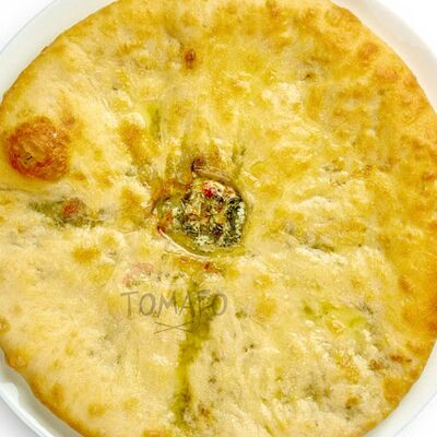 Осетинский пирог с сыром и зеленью в Томаго по цене 1420 ₽