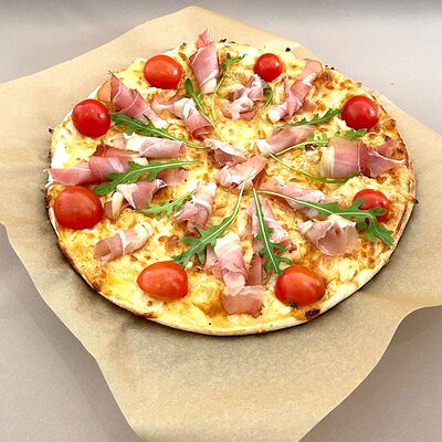 Пицца с пармской ветчиной и рукколой в Piccola Pizza по цене 525 ₽