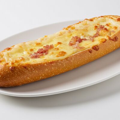 Багет с сыром и колбасойв Дом хлеба по цене 145 ₽