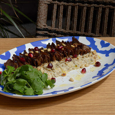 Шашлычок из телячьего языка с мутабалем и зернами граната в Lali по цене 1100 ₽