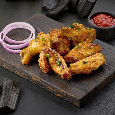 Куриные крылышки на углях в Шик Шашлык по цене 670 ₽