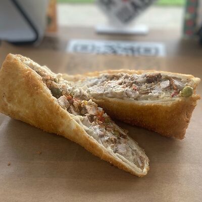 Буррито со свининой в сырном лаваше в темпурев Burritos по цене 315 ₽