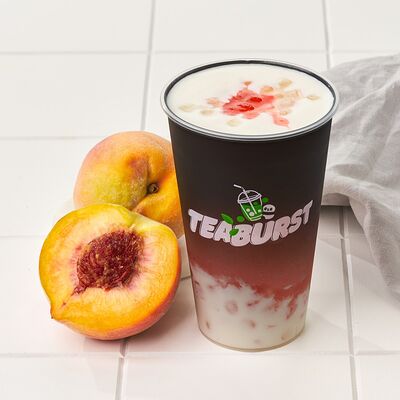 Персиковый холодный напиток со льдом и пенкой в Teaburst bubble tea по цене 400 ₽