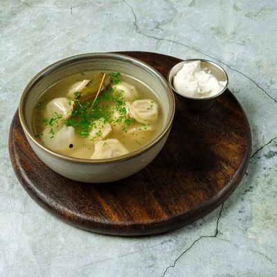 Пельмени с бульоном и сметаной в Moloko по цене 480 ₽