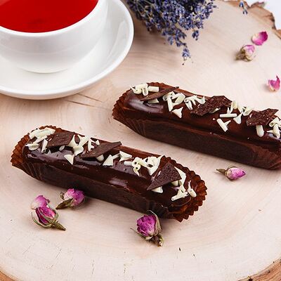 Эклер шоколадный в Много хлеба по цене 161 ₽