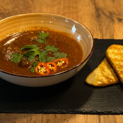 Суп Харчо домашний в Кафе Наше Место по цене 520 ₽