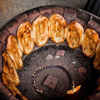 Тандырная лепешка (горячая) в Заречный по цене 75 ₽