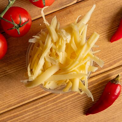 Сыр Моцарелла тертый в НАШ Шеф Донер по цене 59 ₽