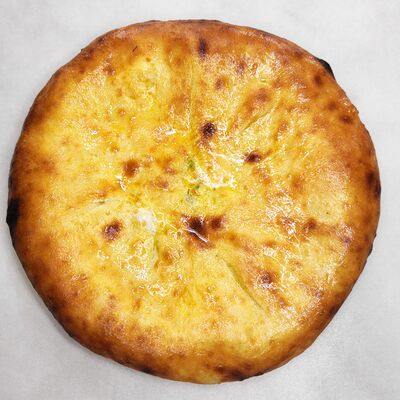 Осетинский пирог с зеленью и сыром сулугуни в Bonape по цене 799 ₽