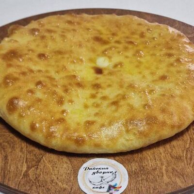 Осетинский пирог с сыром и зеленьюв Райский дворик по цене 550 ₽
