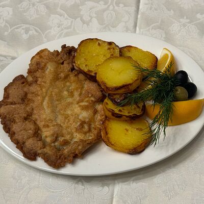 Тилапия в кляре с картофелем по-деревенски в Сказка lounge по цене 640 ₽