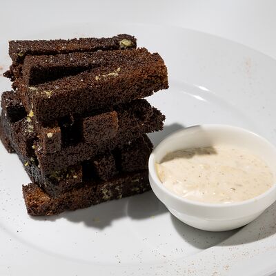 Гренки чесночные в Cyber Octagon по цене 280 ₽